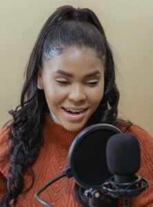 Woman speaking into microphone