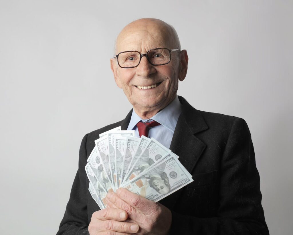 Smiling man holding money