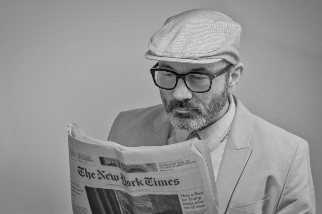 Man reading NY Times newspaper