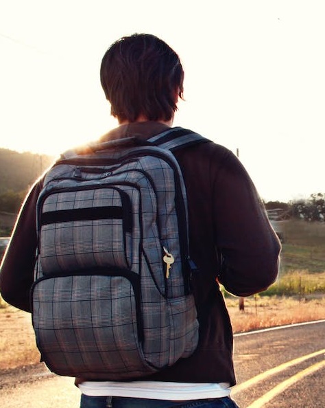 Man with backpack embarking on journey