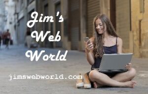 Woman happily using both her phone and her laptop